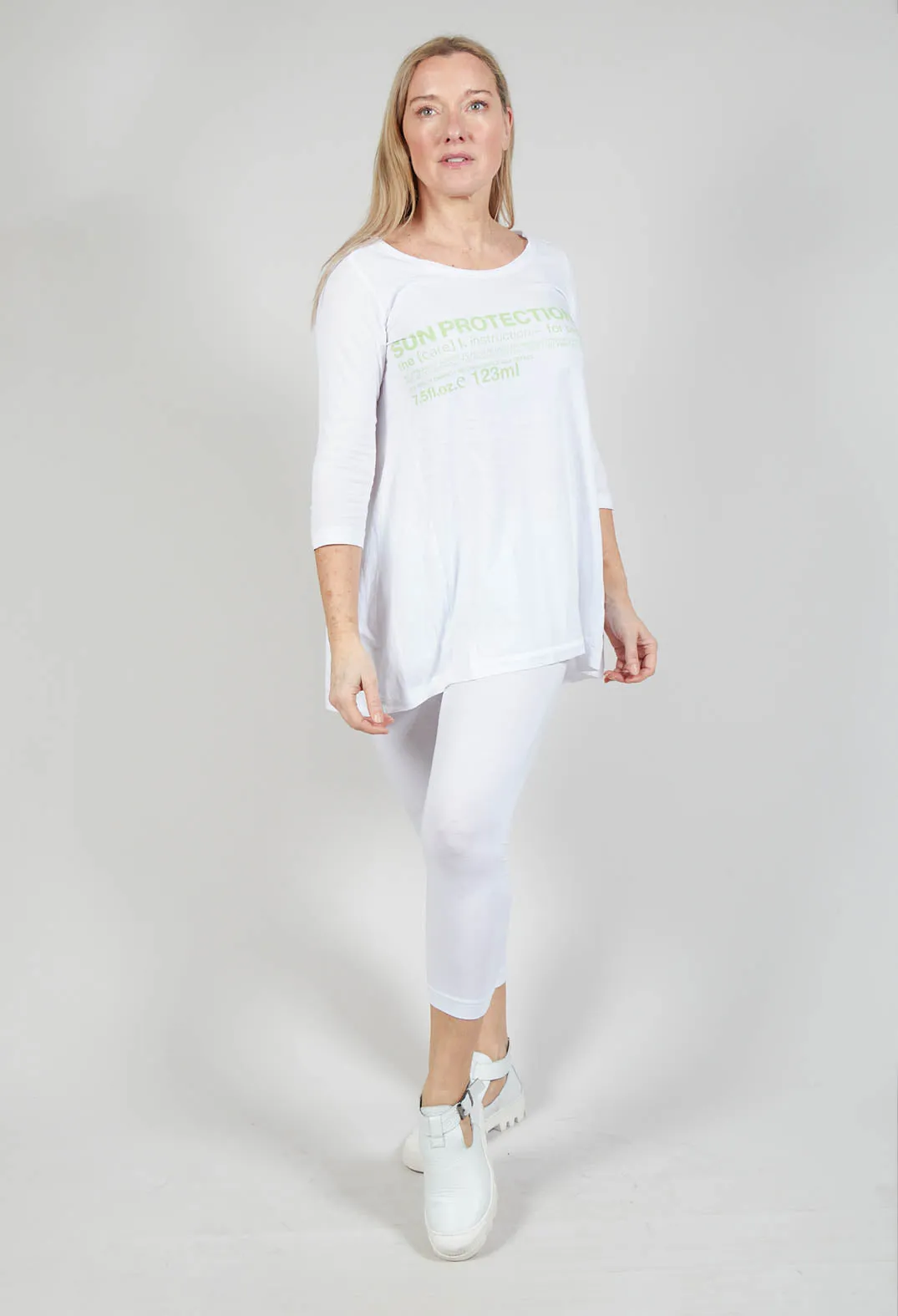 Flared Hem Jersey Top with Motif in Lime Print